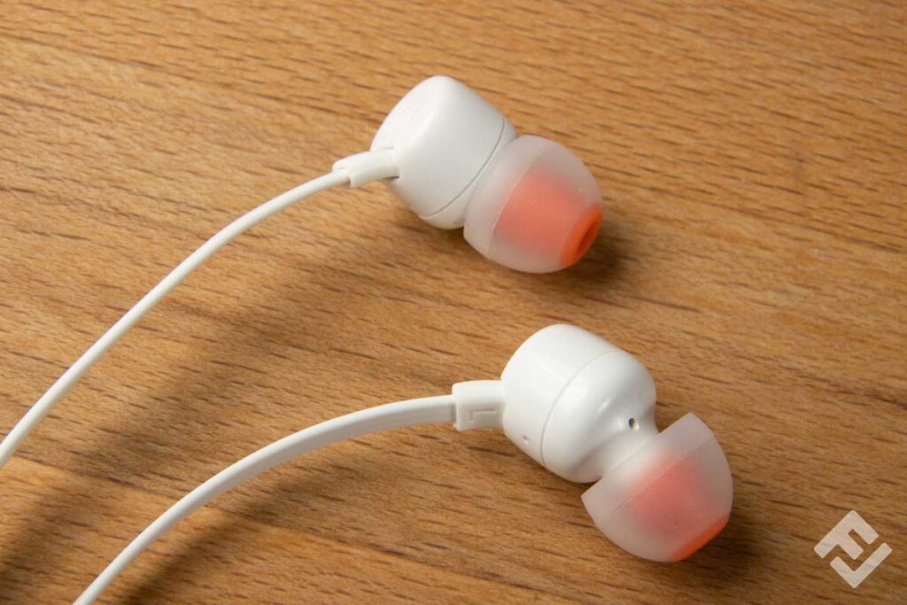 close_up_two_earbuds_on_table